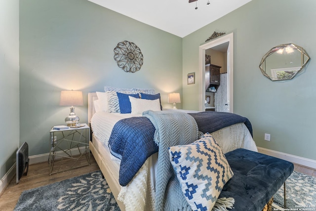 135 Penns Way, Shavano Park, TX 78231 - bedroom with baseboards and wood finished floors