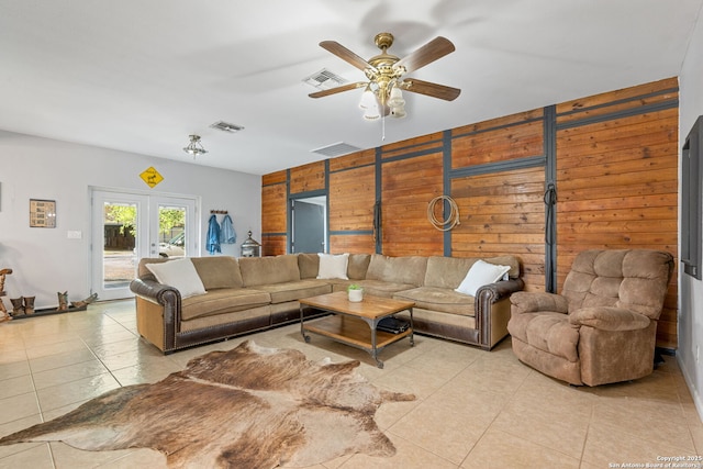 25 Zoeller Ln, Boerne, TX 78006 - living room featuring wooden walls, light tile patterned flooring, and ceiling fan