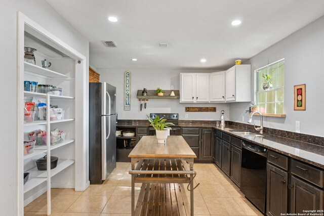 25 Zoeller Ln, Boerne, TX 78006 - kitchen featuring freestanding refrigerator, dishwasher, a sink, electric stove, and white cabinets
