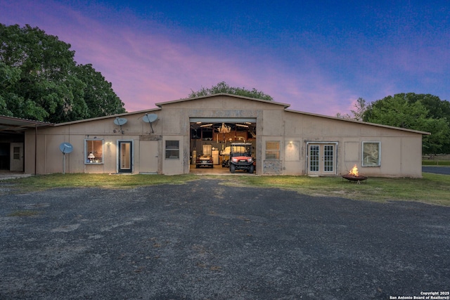 25 Zoeller Ln, Boerne, TX 78006 - back of property at dusk featuring french doors