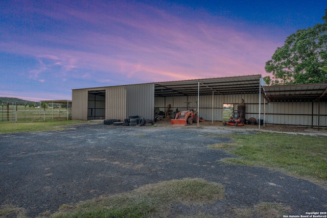 25 Zoeller Ln, Boerne, TX 78006 - view of pole building with fence, a detached carport, and driveway