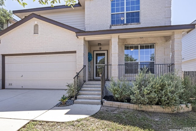 1427 Alaskan Wolf, San Antonio, TX 78245 - doorway to property with brick siding, a garage, driveway, and a porch