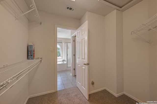 1427 Alaskan Wolf, San Antonio, TX 78245 - spacious closet with light carpet and light tile patterned floors