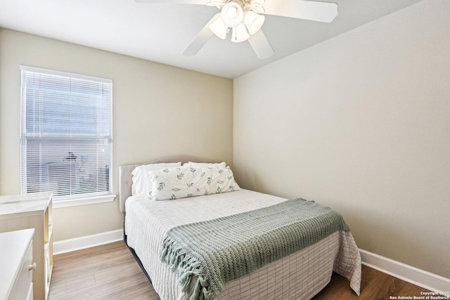 6438 Candleview Ct, San Antonio, TX 78244 - bedroom with light wood finished floors, baseboards, and multiple windows