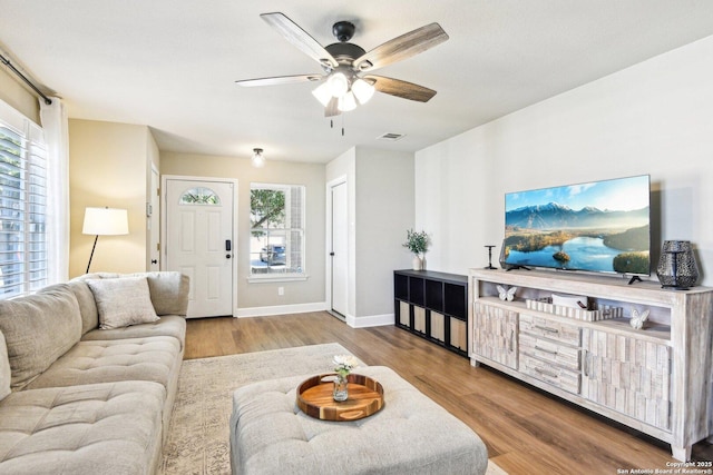 6438 Candleview Ct, San Antonio, TX 78244 - living room with a ceiling fan, wood finished floors, and baseboards