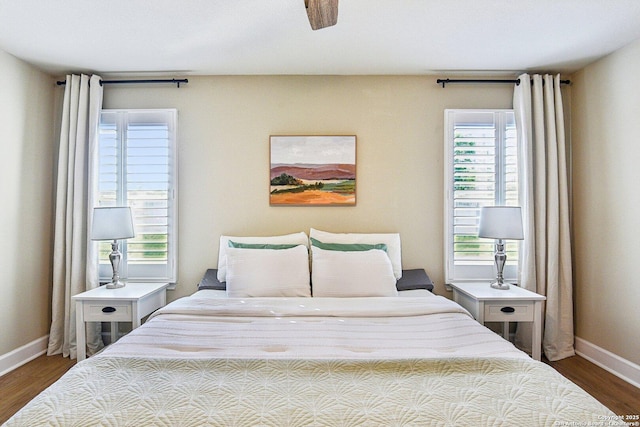 6438 Candleview Ct, San Antonio, TX 78244 - bedroom with baseboards, dark wood-style flooring, and ceiling fan