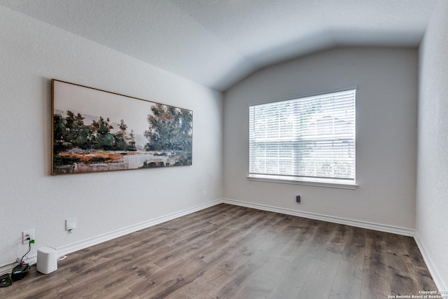 9614 Tupelo Holw, San Antonio, TX 78254 - empty room featuring lofted ceiling, wood finished floors, and baseboards