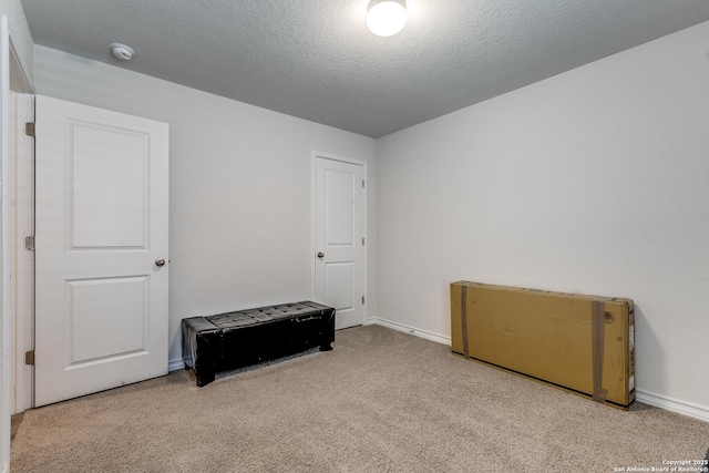 9614 Tupelo Holw, San Antonio, TX 78254 - unfurnished bedroom with carpet flooring, baseboards, and a textured ceiling
