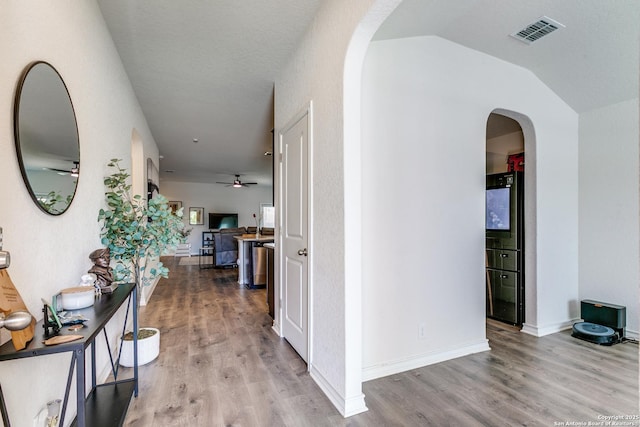 9614 Tupelo Holw, San Antonio, TX 78254 - hall featuring arched walkways, wood finished floors, lofted ceiling, and baseboards