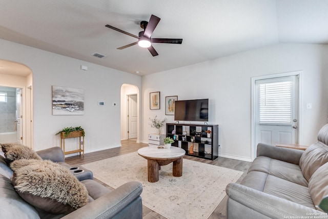 9614 Tupelo Holw, San Antonio, TX 78254 - living area with arched walkways, ceiling fan, wood finished floors, and baseboards