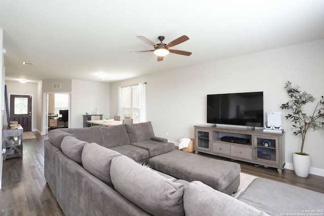 12890 Limestone Way, San Antonio, TX 78253 - living room featuring ceiling fan, dark wood-style flooring, and baseboards