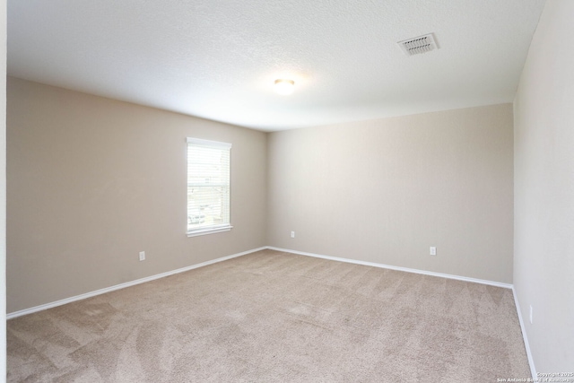 12890 Limestone Way, San Antonio, TX 78253 - spare room featuring light carpet and baseboards