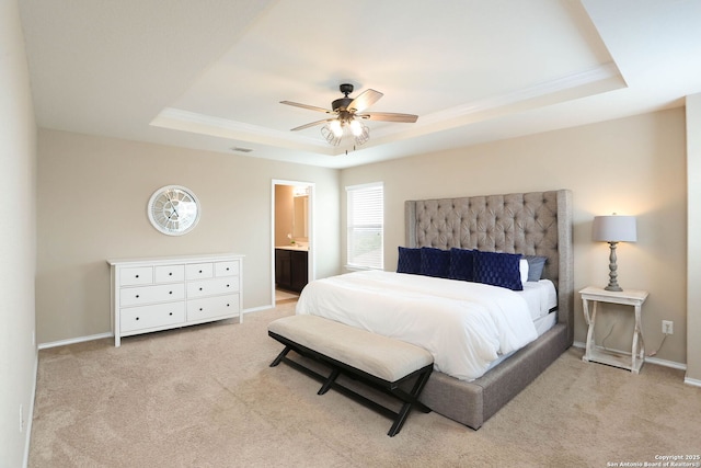 12890 Limestone Way, San Antonio, TX 78253 - bedroom featuring a tray ceiling, light carpet, baseboards, ceiling fan, and ensuite bathroom