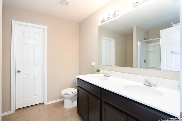 12890 Limestone Way, San Antonio, TX 78253 - full bathroom with a shower with door, toilet, tile patterned floors, double vanity, and baseboards