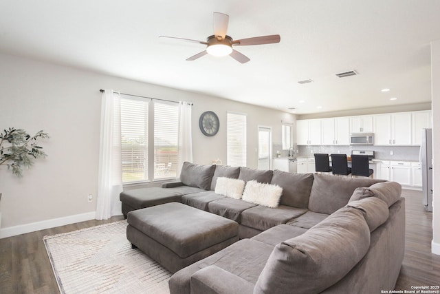12890 Limestone Way, San Antonio, TX 78253 - living room featuring a ceiling fan, wood finished floors, and baseboards