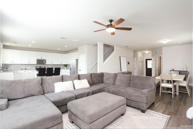 12890 Limestone Way, San Antonio, TX 78253 - living area with wood finished floors, ceiling fan, and stairs