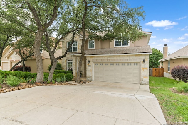 26019 Meadowlark Bay, San Antonio, TX 78260 - traditional-style home with stone siding, an attached garage, and driveway