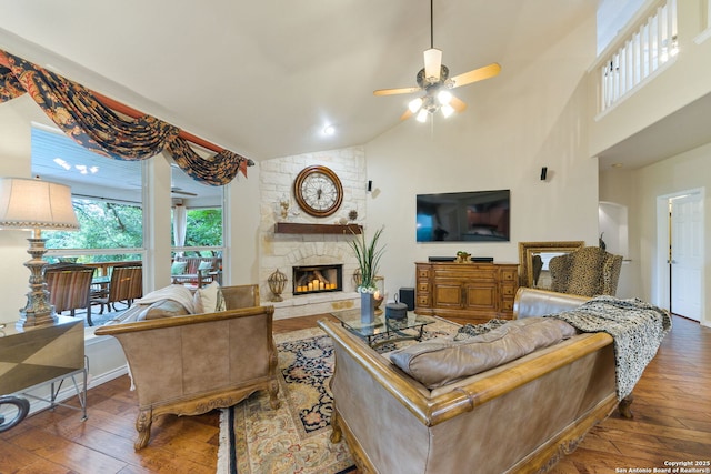 26019 Meadowlark Bay, San Antonio, TX 78260 - living room featuring wood-type flooring, ceiling fan, a fireplace, and high vaulted ceiling