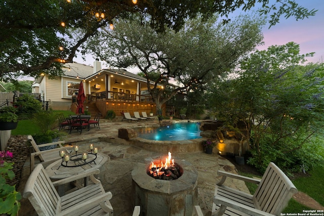 26019 Meadowlark Bay, San Antonio, TX 78260 - view of patio featuring a fire pit, ceiling fan, an outdoor pool, stairway, and a wooden deck