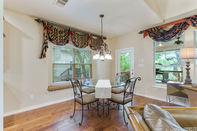 26019 Meadowlark Bay, San Antonio, TX 78260 - dining room with wood-type flooring, baseboards, and a chandelier