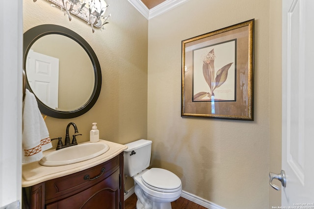 26019 Meadowlark Bay, San Antonio, TX 78260 - half bathroom with vanity, crown molding, toilet, and baseboards