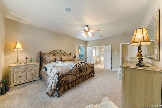 26019 Meadowlark Bay, San Antonio, TX 78260 - bedroom with light carpet, ensuite bath, and a ceiling fan