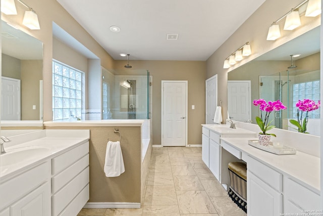 26019 Meadowlark Bay, San Antonio, TX 78260 - bathroom with a shower stall, marble finish floors, two vanities, and baseboards