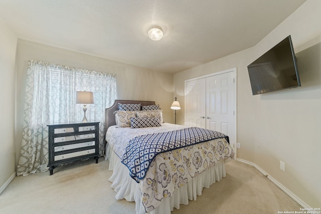 26019 Meadowlark Bay, San Antonio, TX 78260 - bedroom with light colored carpet, a closet, and baseboards