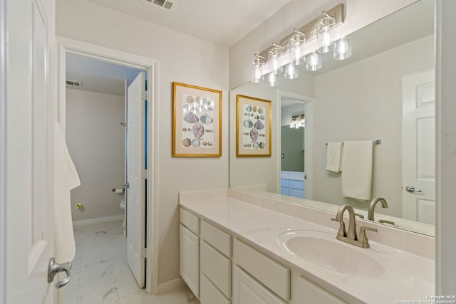26019 Meadowlark Bay, San Antonio, TX 78260 - bathroom with marble finish floors, toilet, vanity, and baseboards