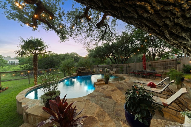26019 Meadowlark Bay, San Antonio, TX 78260 - pool at dusk with a patio area