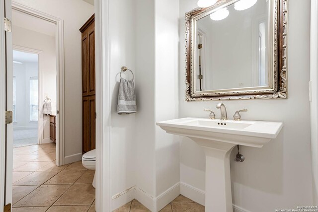 132 Long Bow Rd, Shavano Park, TX 78231 - bathroom featuring toilet, tile patterned flooring, and baseboards