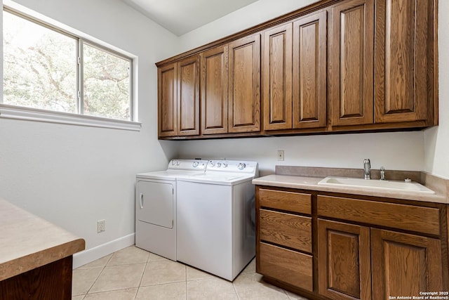 132 Long Bow Rd, Shavano Park, TX 78231 - washroom featuring washer and dryer, cabinet space, light tile patterned floors, and baseboards