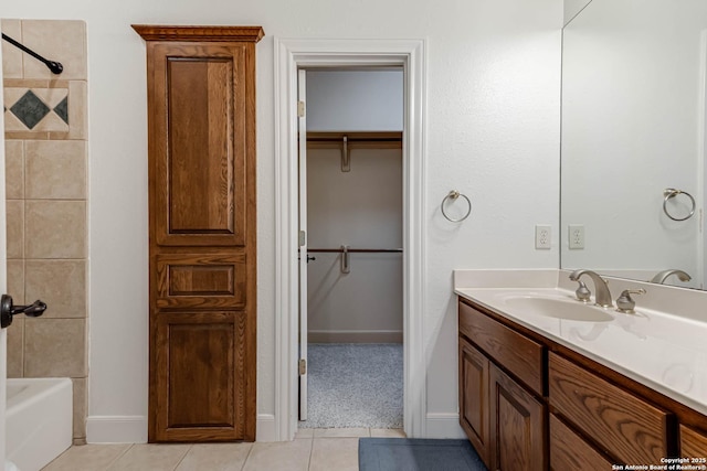 132 Long Bow Rd, Shavano Park, TX 78231 - full bath featuring vanity, tile patterned flooring, a spacious closet, washtub / shower combination, and baseboards