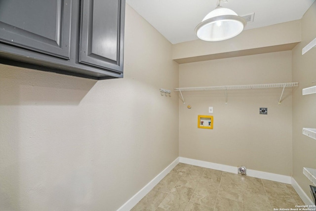 7230 Sunrise Lk, San Antonio, TX 78244 - laundry room with electric dryer hookup, hookup for a washing machine, cabinet space, baseboards, and light tile patterned flooring