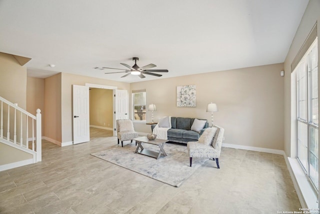 7230 Sunrise Lk, San Antonio, TX 78244 - living area featuring stairs, a ceiling fan, and baseboards