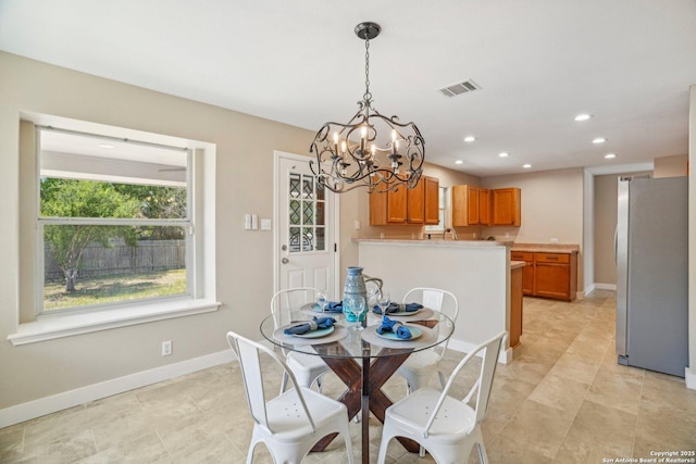 7230 Sunrise Lk, San Antonio, TX 78244 - dining area featuring a chandelier, recessed lighting, baseboards, and light tile patterned floors