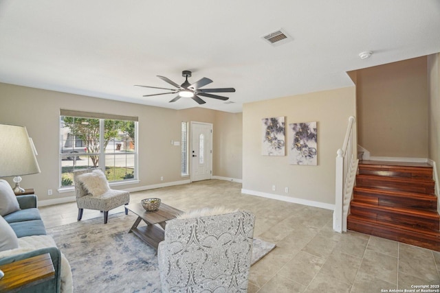 7230 Sunrise Lk, San Antonio, TX 78244 - living area with a ceiling fan, stairway, and baseboards