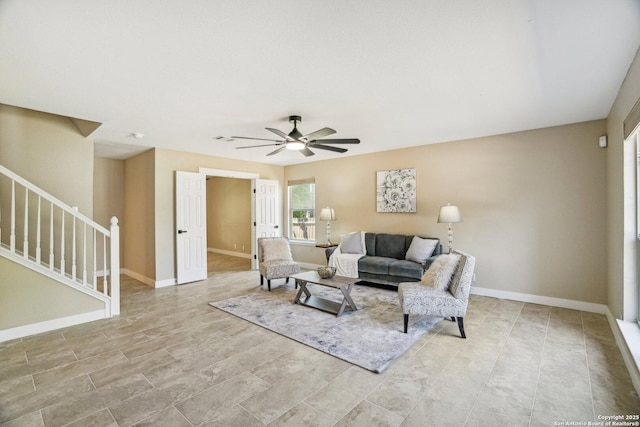 7230 Sunrise Lk, San Antonio, TX 78244 - living area featuring stairway, ceiling fan, and baseboards
