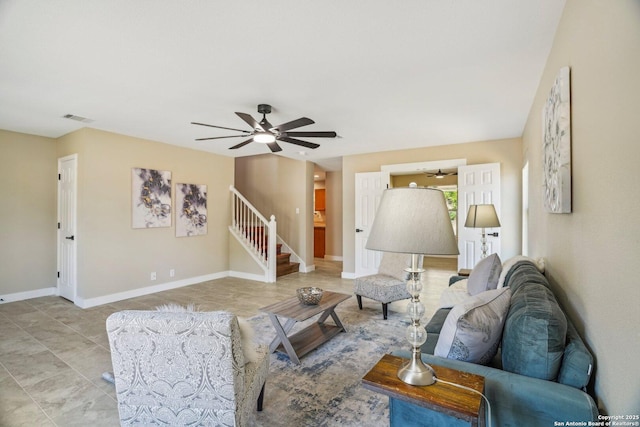 7230 Sunrise Lk, San Antonio, TX 78244 - living room featuring a ceiling fan, baseboards, and stairway