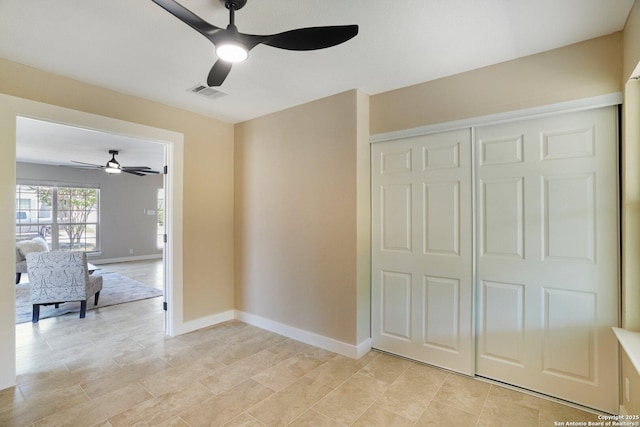 7230 Sunrise Lk, San Antonio, TX 78244 - unfurnished bedroom featuring ceiling fan, baseboards, a closet, and light tile patterned flooring