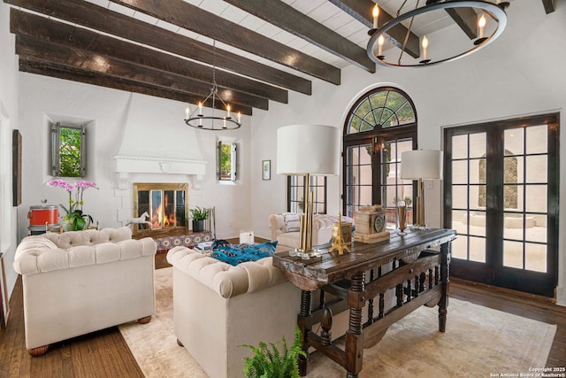 241 W Elsmere, San Antonio, TX 78212 - living room featuring a chandelier, french doors, beamed ceiling, wood finished floors, and a large fireplace