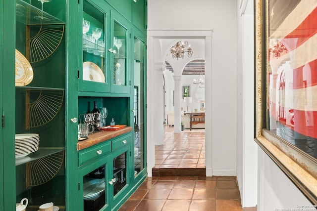 241 W Elsmere, San Antonio, TX 78212 - corridor with dark tile patterned floors and arched walkways