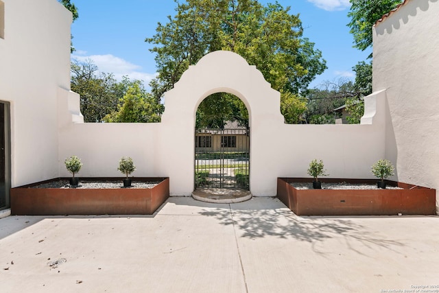 241 W Elsmere, San Antonio, TX 78212 - view of patio featuring fence and a gate