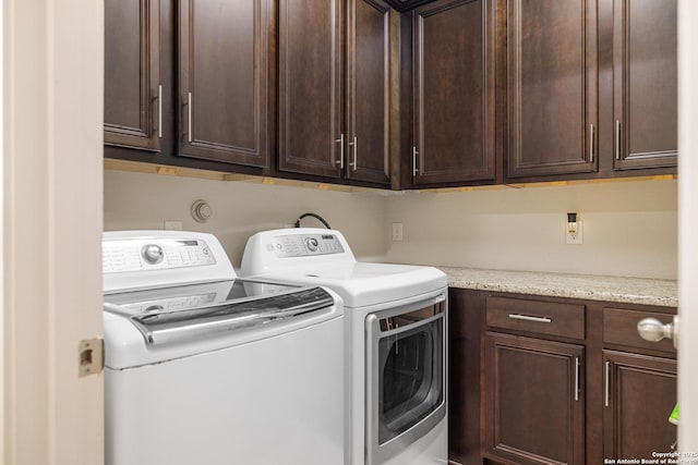 4438 Saddle Spur, San Antonio, TX 78253 - clothes washing area with independent washer and dryer and cabinet space