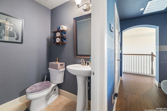 4438 Saddle Spur, San Antonio, TX 78253 - half bath featuring toilet, baseboards, and a textured wall