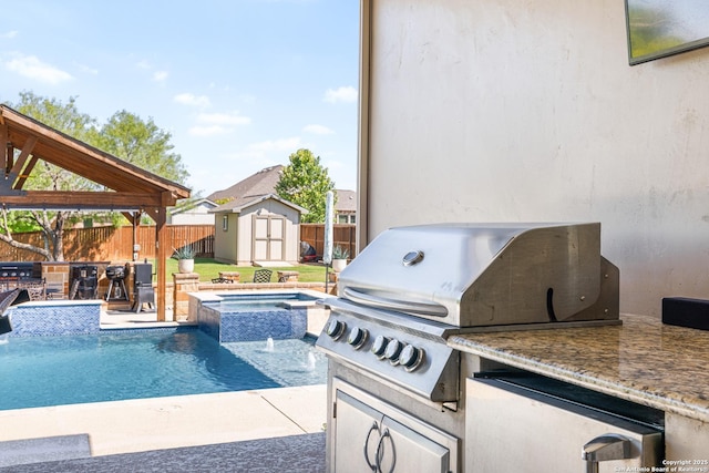 4438 Saddle Spur, San Antonio, TX 78253 - view of swimming pool with area for grilling, an outdoor kitchen, a fenced backyard, and a storage shed