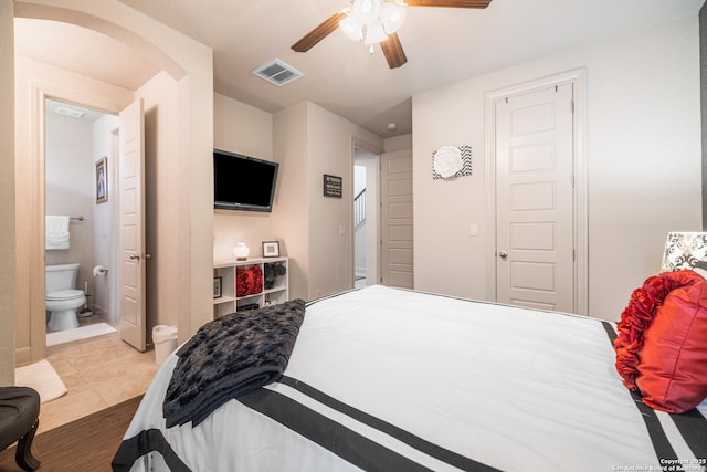 4438 Saddle Spur, San Antonio, TX 78253 - bedroom featuring wood finished floors, ensuite bath, and a ceiling fan
