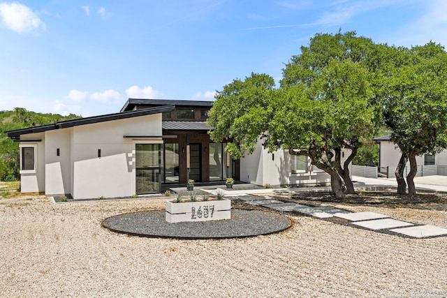 2637 Campestres, Spring Branch, TX 78070 - rear view of property with stucco siding, metal roof, and a standing seam roof