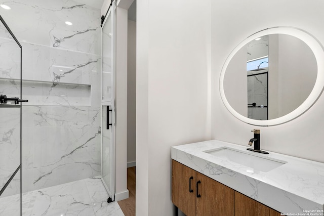 2637 Campestres, Spring Branch, TX 78070 - bathroom with marble look tiles, a marble finish shower, vanity, and baseboards