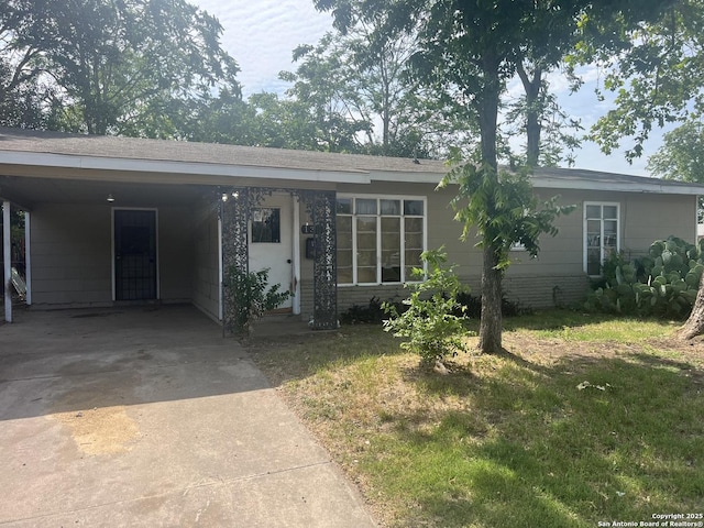 130 Eastwood, San Antonio, TX 78220 - view of front facade featuring concrete driveway, a front lawn, and an attached carport